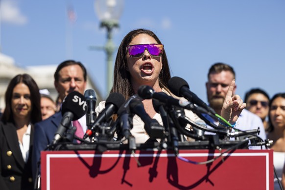 epa12349620 Survivor of the Jeffrey Epstein and Ghislaine Maxwell sex-trafficking scandal Haley Robson speaks at a press conference with other survivors outside the US Capitol in Washington, DC, USA,  ...