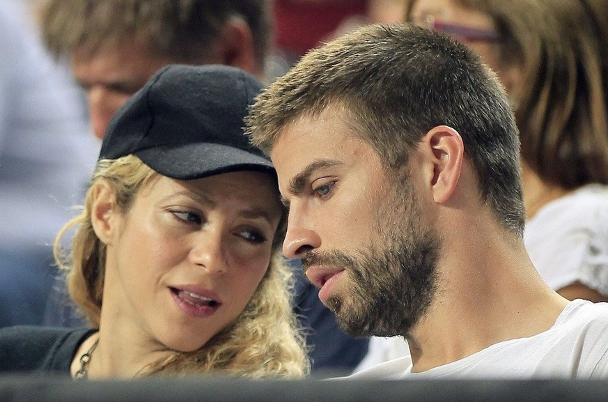 epa04393074 Colombian singer Shakira (L) and FC Barcelona soccer team player Gerard Pique (R) watch the FIBA Basketball World Cup quarter final match between Slovenia and USA played at Sant Jordi Pala ...