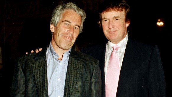 Portrait of American financier Jeffrey Epstein (left) and real estate developer Donald Trump as they pose together at the Mar-a-Lago estate, Palm Beach, Florida, 1997.(Photo by Davidoff Studios/Getty  ...