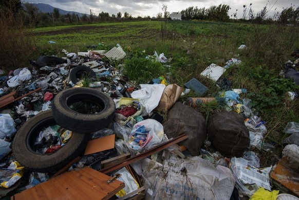 In this Nov. 18, 2013 photo, rubbish is piled on the edge of cultivated land near Caivano, in the surroundings of Naples, southern Italy. Dozens of fields in the area were sequestered by police, prohi ...