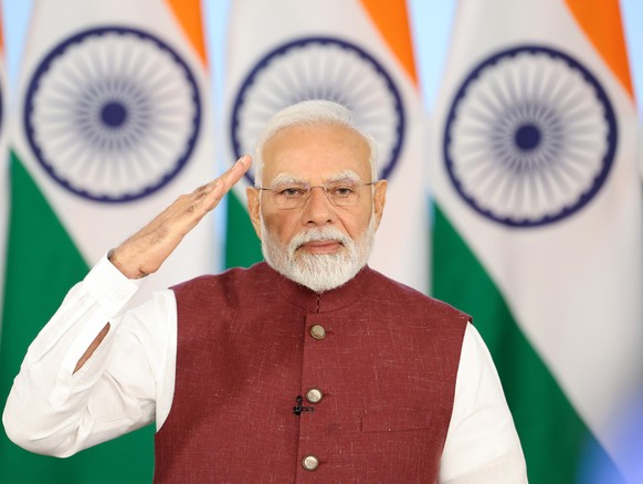 epa12094472 A handout photo made available by the press information bureau (PIB) shows Indian Prime Minister Narendra Modi salutes as he addresses the nation in New Delhi, India, 12 May 2025. Pakistan ...