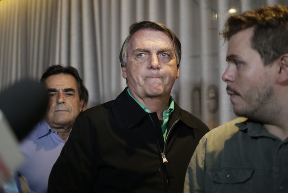 FILE - Brazil&#039;s former President Jair Bolsonaro prepares to speak to the press at a restaurant in Belo Horizonte, Brazil, June 30, 2023, the day that judges ruled him ineligible to run for any po ...