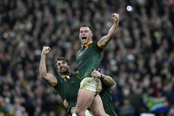 South Africa&#039;s Jesse Kriel, right, and South Africa&#039;s Eben Etzebeth celebrate after the Rugby World Cup final match between New Zealand and South Africa at the Stade de France in Saint-Denis ...