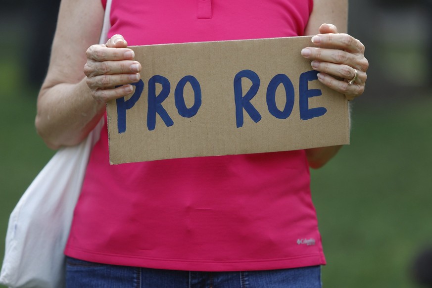 Protesters display their signs on Friday, June 24, 2022, at North Straub Park in St. Petersburg, Fla. The Supreme Court on Friday stripped away women���s constitutional protections for abortion, a fun ...