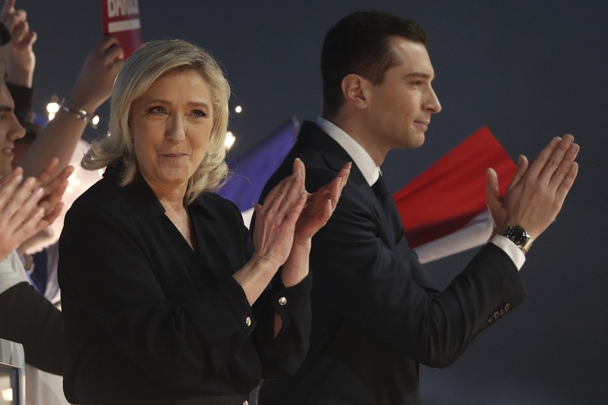 epa11196843 President of the French far-right National Rally party (RN-Rassemblement National in French) Jordan Bardella (R) and party&#039;s parliamentary leader Marine Le Pen (L) react after deliver ...