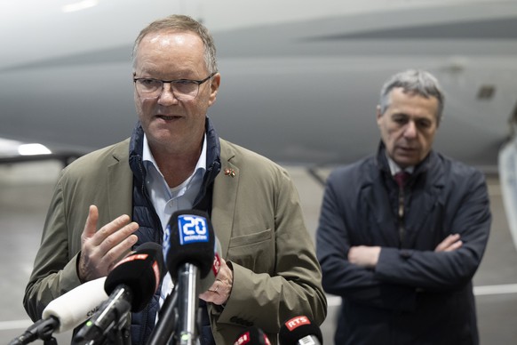 Swiss Federal Councilor Ignazio Cassis, right, and Christian Winter, Swiss Ambassador of Sudan, speak during a press conference at the Bern-Belp Airport in Belp, Switzerland, Tuesday, April 25, 2023.  ...