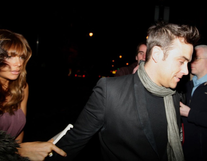 Robbie Williams arrives with Ayda Field for the opening night of the We Will Rock You musical at the Palace Theatre, Manchester. (Photo by Dave Thompson - PA Images/PA Images via Getty Images)