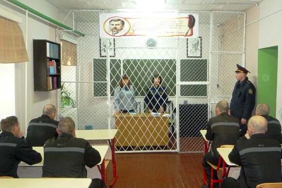 In this photo released by The Russian Federal Penitentiary Service (FPS) on Thursday, Sept. 28, 2023, group of prisoners sit during classes inside a prison colony in the town of Kharp, in the Yamalo-N ...
