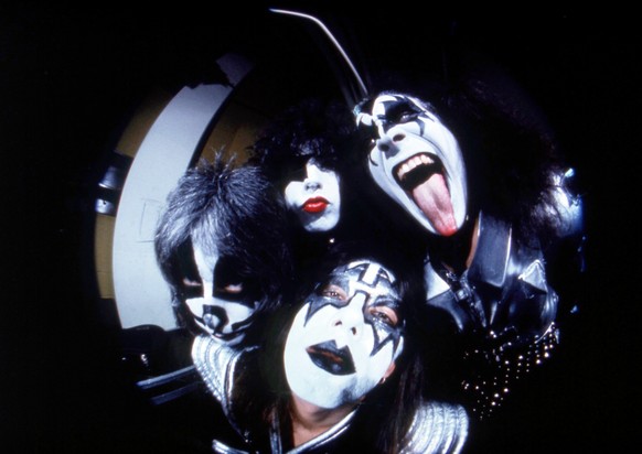 FILE - In this image taken with a fisheye lens, members of the rock group Kiss, clockwise from right, Gene Simmons,, Ace Frehley, Peter Criss and Paul Stanley pose before a concert in Hartford, Conn., ...