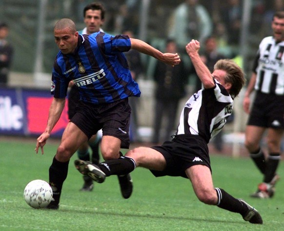 French star Didier Deschamps of Juventus, right, tries to stop Brazilian soccer ace Ronaldo of Internazionale of Milan during Juventus vs Inter First Division soccer match in Turin&#039;s Delle Alpi s ...