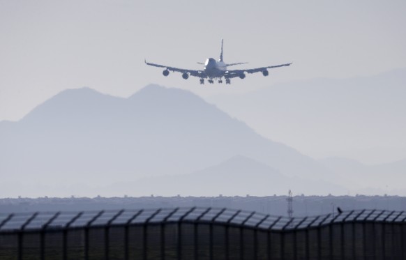 An airplane prepares to land at March Air Reserve Base in Riverside, Calif. Jan. 29, 2020. Congress is looking into just how quickly airline passengers can evacuate a plane during an emergency. Some l ...
