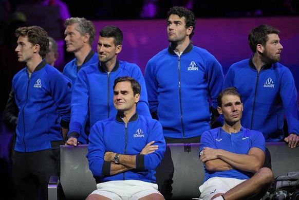 An emotional Roger Federer, left, of Team Europe sits alongside his playing partner Rafael Nadal after their Laver Cup doubles match against Team World&#039;s Jack Sock and Frances Tiafoe at the O2 ar ...