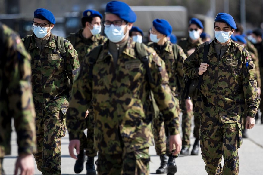 Soldiers from the Swiss Army &quot;Bataillon Hopital 2&quot; from &quot;Division territoriale 1&quot; walk as they practice health and medical exercises in the military camp before being deployed in s ...