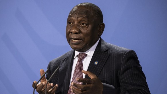 epa09432771 President of the South Africa Cyril Ramaphosa attends a press conference after the G20 Compact with Africa conference at the Chancellery in Berlin, Germany, 27 August 2021. EPA/MAJA HITIJ  ...