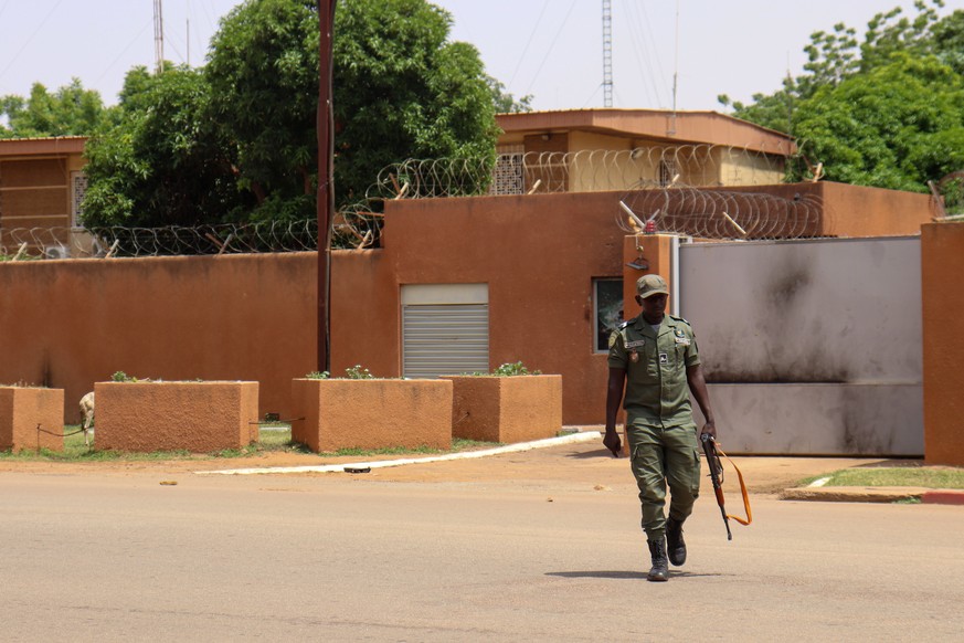 epa10833646 An armed military man patrols outside the French embassy in Niamey, Niger, 01 September 2023 According to the current Niger Ministry of Foreign Affairs and Cooperation, following the end o ...