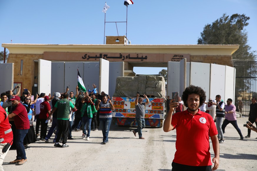 epa10930320 A truck carrying humanitarian aid for the Gaza Strip crosses the Rafah border gate, in Rafah, Egypt, 21 October 2023. As Egypt is to host, on 21 October, an international summit about Gaza ...