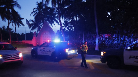 Police direct traffic outside an entrance to former President Donald Trump&#039;s Mar-a-Lago estate, Monday, Aug. 8, 2022, in Palm Beach, Fla. Trump said in a lengthy statement that the FBI was conduc ...