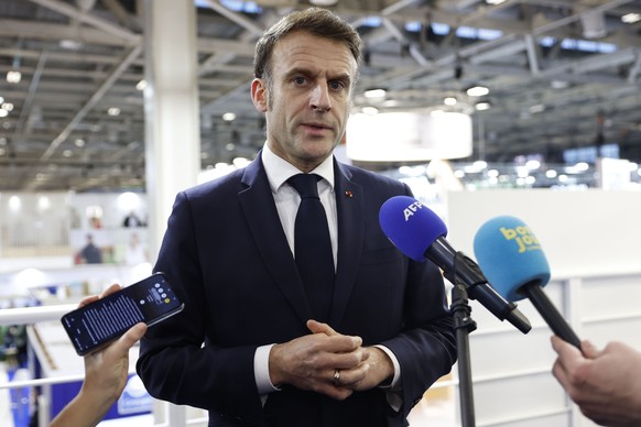 epa11916412 French President Emmanuel Macron speaks to journalists about a knife attack in Mulhouse that occurred earlier in the day, as he attends the opening day of the 61st International Agricultur ...