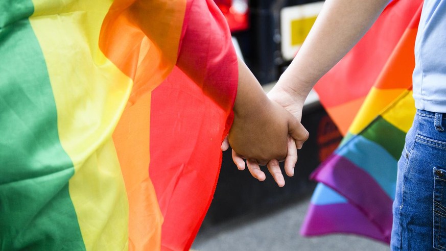 Members of the Gay and Lesbian community participate at the Gay Pride parade in Fribourg, Switzerland, 25 June 2016. (KEYSTONE/Manuel Lopez)