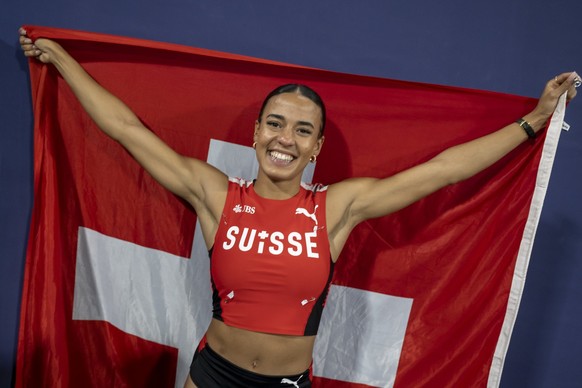 Switzerland&#039;s third-placed Ditaji Kambundji cheers after the Women&#039;s 100 m Hurdles Final at the 2022 European Championships Munich, in the Olympiastadion in Munich, Germany, on Sunday, Augus ...