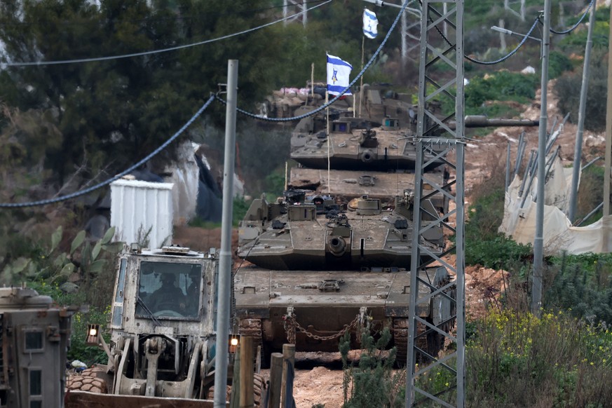 epa11918608 Israeli forces with tanks and army vehicles enter Jenin refugee camp in the West Bank city of Jenin, 23 February 2025. The Israeli military launched a military operation in Jenin and its c ...