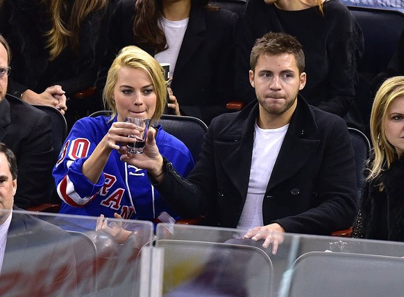 NEW YORK, NY - FEBRUARY 26: Margot Robbie and Tom Ackerley attend the Arizona Coyotes vs New York Rangers game at Madison Square Garden on February 26, 2015 in New York City. (Photo by James Devaney/G ...