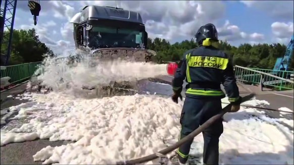 In this photo released by Russian Emergency Ministry Press Service telegram channel on Sunday, June 1, 2025, emergency employees work at a damaged bridge in Russia&#039;s Bryansk region, which borders ...