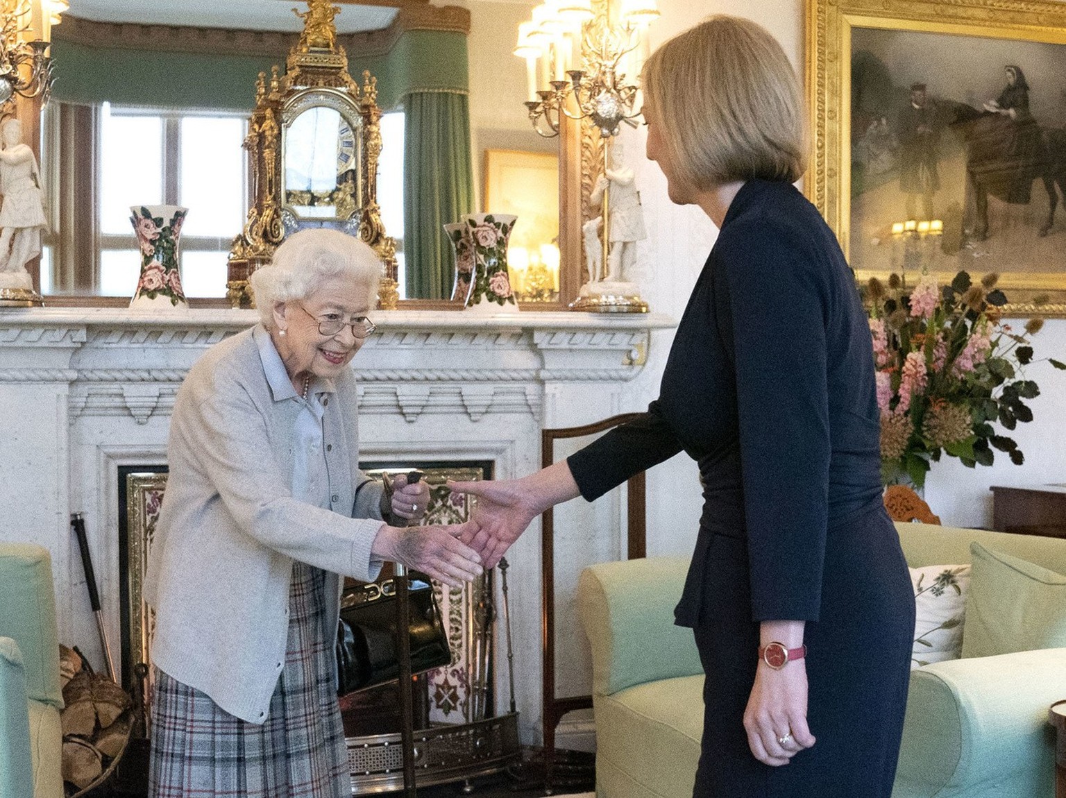 Britain&#039;s Queen Elizabeth II, left, welcomes Liz Truss during an audience at Balmoral, Scotland, where she invited the newly elected leader of the Conservative party to become Prime Minister and  ...