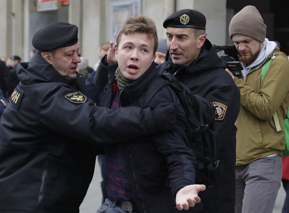 FILE - In this Sunday, March 26, 2017 file photo, Belarus police detain journalist Raman Pratasevich, center, in Minsk, Belarus. Raman Pratasevich, a founder of a messaging app channel that has been a ...