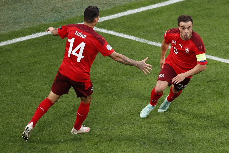 Switzerland&#039;s Xherdan Shaqiri, right, celebrates with Switzerland&#039;s Steven Zuber after scoring his sides first goal during the Euro 2020 soccer championship quarterfinal match between Switze ...