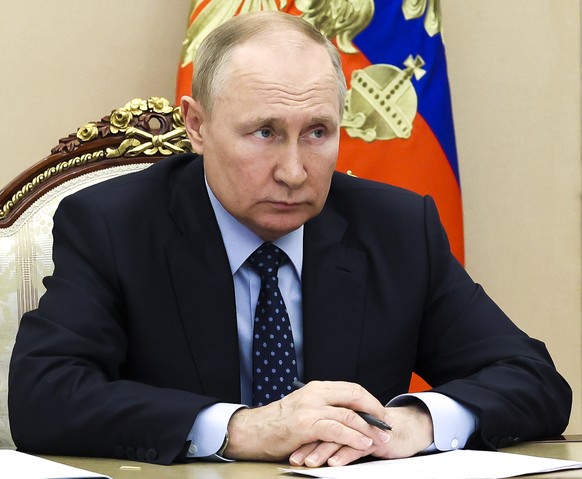 Russian President Vladimir Putin attends a cabinet meeting via videoconference in Moscow, Russia, Friday, July 8, 2022. (Mikhail Klimentyev, Sputnik, Kremlin Pool Photo via AP)