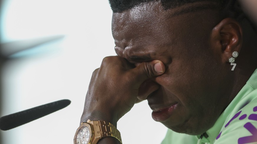 epa11243020 Brazil player Vinicius Junior sheds a tear as he attends a press conference in Madrid, Spain, 25 March 2024. Real Madrid player Vinicius Jr was asked by the media about the racist abuse he ...