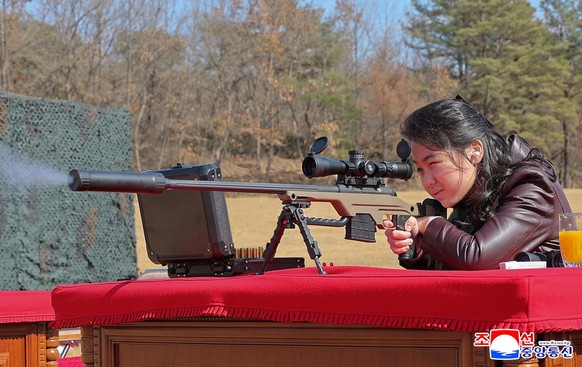 epa12782859 A photo released by the official North Korean Central News Agency (KCNA) shows North Korean leader Kim Jong Un's daughter kim Ju Ae firing a new-type sniper rifle at an undisclosed sh ...