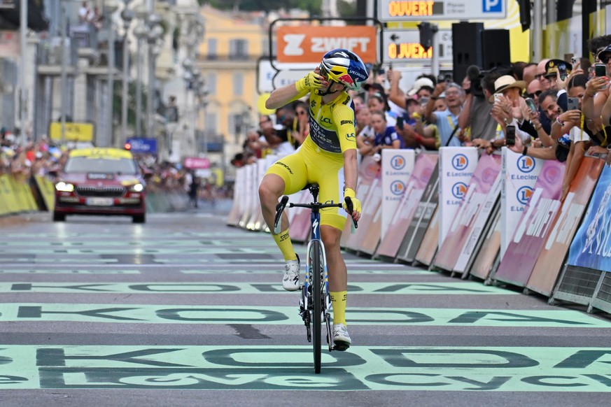 Netherlands' Demi Vollering celebrates as she crosses the finish line to win the ninth stage of the Women's Tour de France cycling race (Tour de France Femmes) in Nice, France, Sunday, Aug.  ...