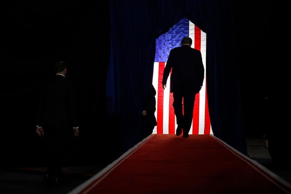 MANCHESTER, NEW HAMPSHIRE - JANUARY 20: Republican presidential candidate and former President Donald Trump walks off the stage at the conclusion of a campaign rally at the SNHU Arena on January 20, 2 ...