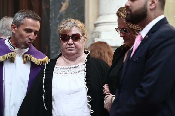 Violette Petrucciani (C), mother of Loana, arrives to attend the funeral ceremony of Loana Petrucciani, the first reality TV star in France, at the cathedral of Sainte-Reparate in Nice, southeastern F ...