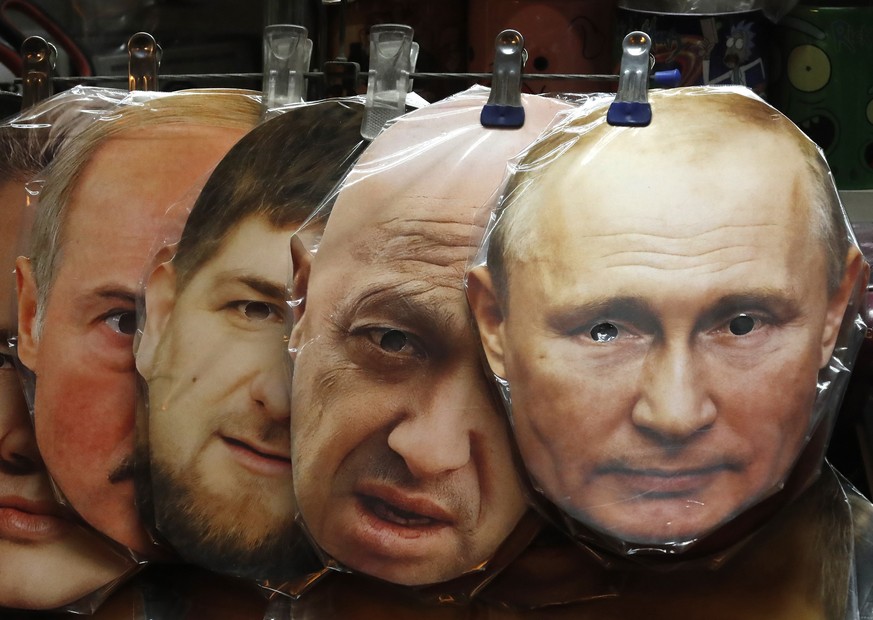 epa10674462 Face masks depicting (from-R) Russian President Vladimir Putin, owner of PMC (Private Military Company) Wagner Yeugeny Prigozhin, Chechen&#039;s regional leader Ramzan Kadyrov and Belarusi ...