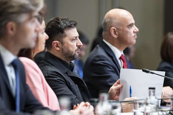 epa12596082 The Secretary General of the Council of Europe, Alain Berset (L), and Ukrainian President Volodymyr Zelensky (C) attend a Council of Europe meeting at the World Forum in The Hague, Netherl ...