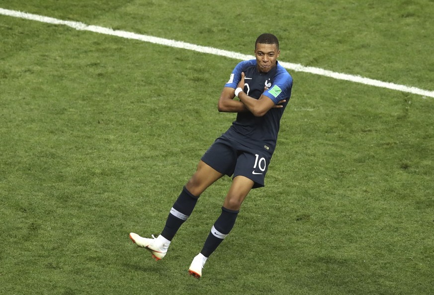 France's Kylian Mbappe celebrates after scoring his side's fourth goal during the final match between France and Croatia at the 2018 soccer World Cup in the Luzhniki Stadium in Moscow, Russi ...
