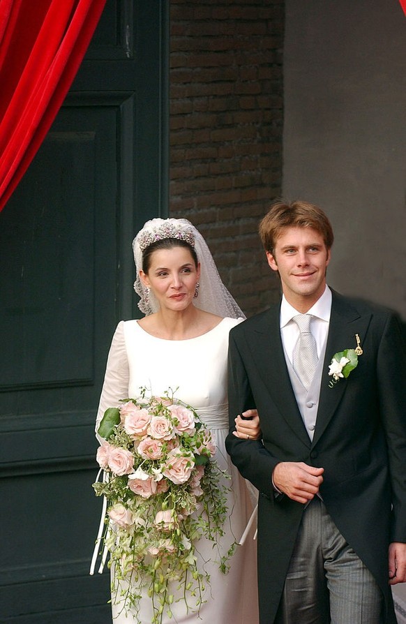 ROME - SEPTEMBER 25: Emmanuele Filiberto, the head of the Royal House of Savoy and son of Italy&#039;s last king, walks with his new bride French actress Clotilde Courau as they leave the Basilica of  ...