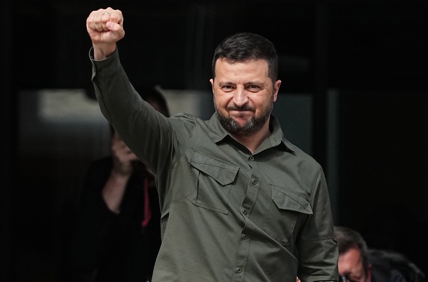 epa10811481 Ukrainian President Volodymyr Zelensky reacts after speaking to the crowd in front of the Danish Parliament in Copenhagen, Denmark, 21 August 2023. Ukrainian President Volodymyr Zelensky a ...