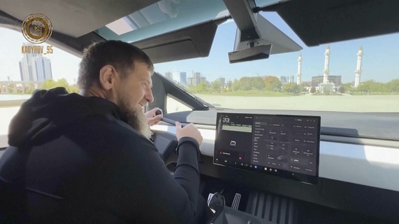 In this image from video posted by Chechen leader Ramzan Kadyrov&#039;s Telegram channel on Saturday, Aug. 17, 2024, Kadyrov drives a Tesla Cybertruck equipped with a machine gun in Grozny, Chechnya.  ...
