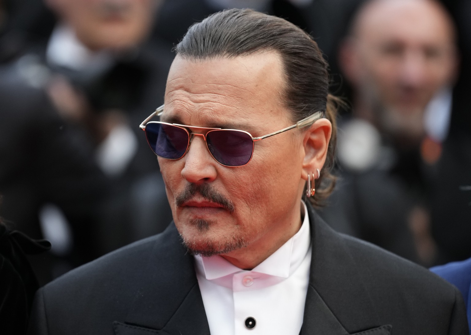 Johnny Depp poses for photographers upon arrival at the opening ceremony and the premiere of the film &#039;Jeanne du Barry&#039; at the 76th international film festival, Cannes, southern France, Tues ...