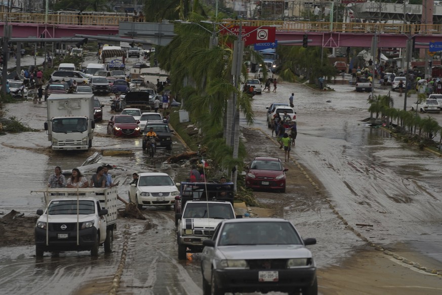 Cars cross a flood-damaged avenue after Hurricane Otis ripped through Acapulco, Mexico, Wednesday, Oct. 25, 2023. Hurricane Otis ripped through Mexico&#039;s southern Pacific coast as a powerful Categ ...