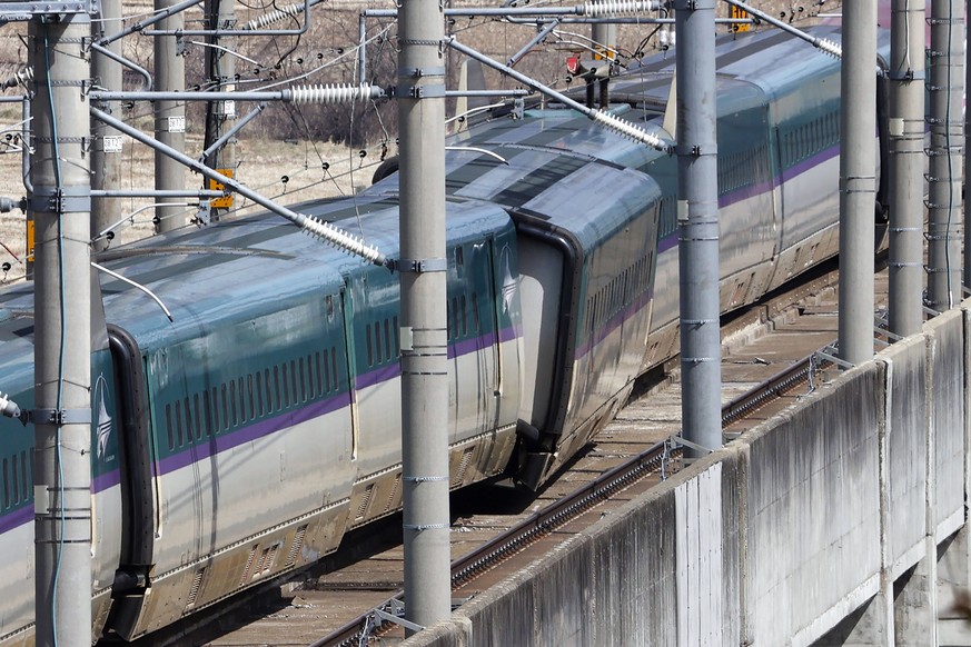 A partially derailed express train sits following an earthquake in Shiroishi, Miyagi prefecture, northern Japan Thursday, March 17, 2022. A powerful earthquake struck off the coast of Fukushima in nor ...