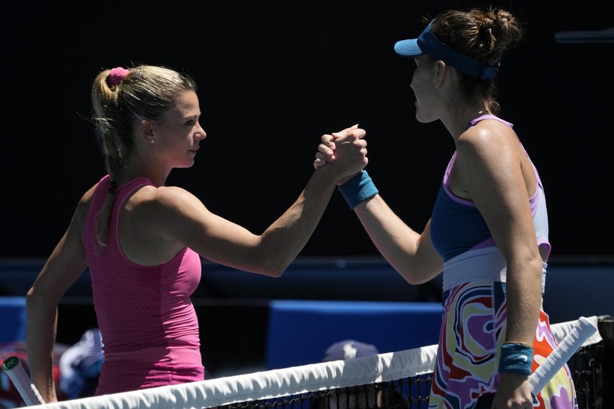 Belinda Bencic, right, of Switzerland is congratulated by Camila Giorgi of Italy following their third round match at the Australian Open tennis championship in Melbourne, Australia, Saturday, Jan. 21 ...