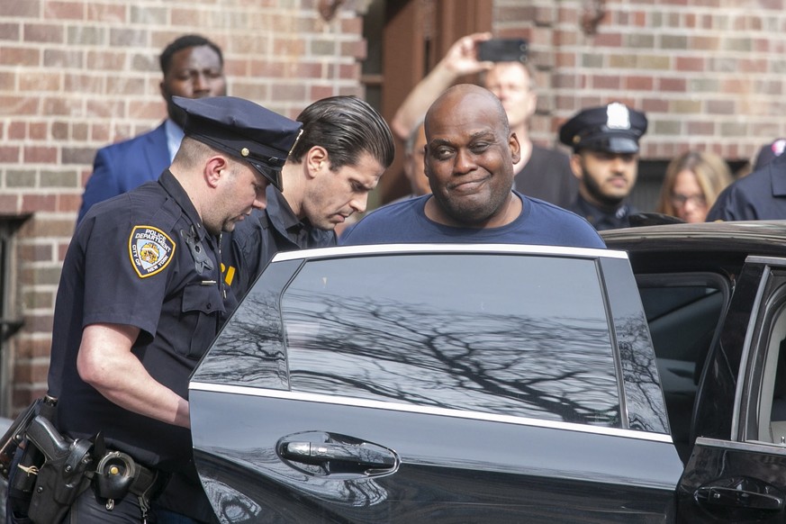 epaselect epa09888793 Frank James reacts to reporters asking him questions while being escorted out of the 9th Precinct after being charged for allegedly opening fire on a subway in Brooklyn a day ear ...