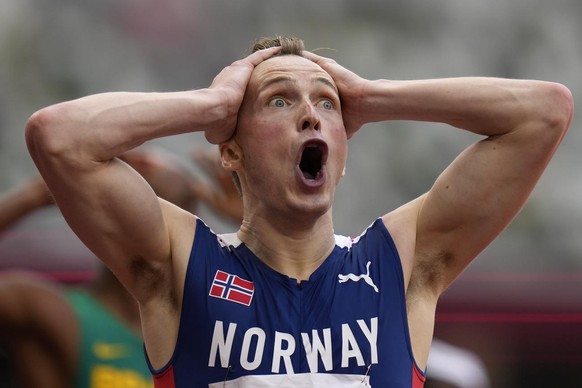 Karsten Warholm, of Norway, reacts after winning the men&#039;s 400-meter hurdles final at the 2020 Summer Olympics, Tuesday, Aug. 3, 2021, in Tokyo. (AP Photo/Petr David Josek)