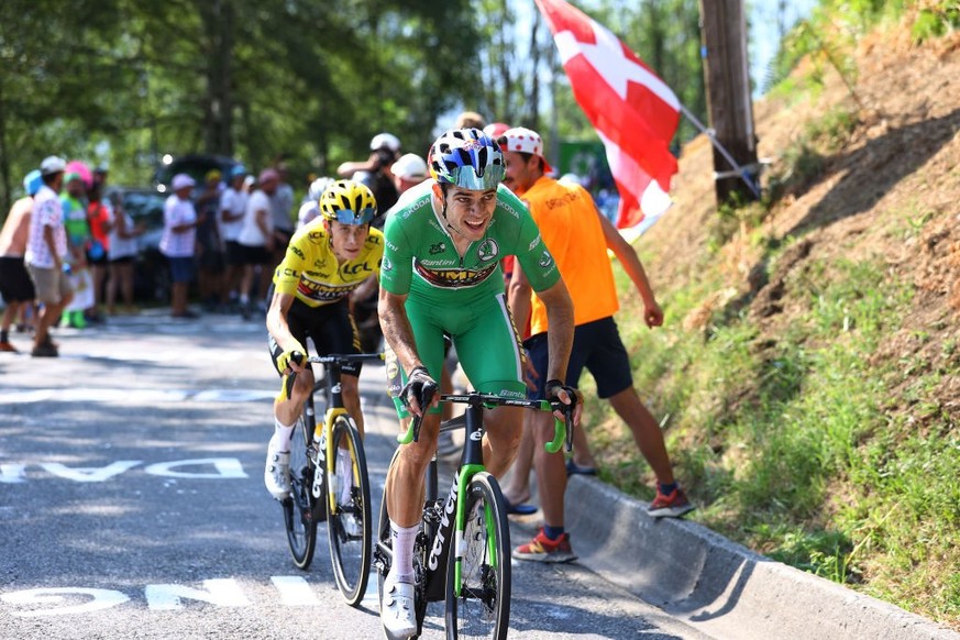 HAUTACAM, FRANCE - JULY 21: (L-R) Jonas Vingegaard Rasmussen of Denmark and Team Jumbo - Visma - Yellow Leader Jersey and Wout Van Aert of Belgium and Team Jumbo - Visma - Green Points Jersey compete  ...