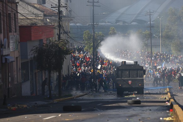 epa10030760 Police disperse protesters trying to reach the National Assembly headquarters in Quito, Ecuador, 23 June 2022. In the demonstrations that began on June 13, the indigenous people ask that t ...